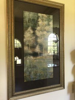Large print in gold leaf frame