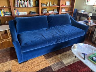 Large blue velvet sofa