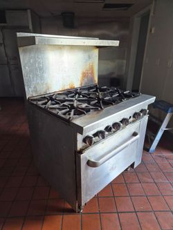 Commercial Restaurant 6 Burner Gas Range with Six Standard Oven
Works, Needs Cleaning