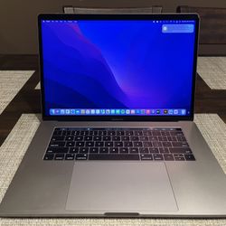 Apple MacBook Pro 15-inch With Touch Bar , 2.6GHz Quad-Core intel Core i7, 16GB RAM, 256GB SSD