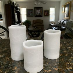 New 3 Flameless Pillar candles in the box. Has a timer function. Light gray