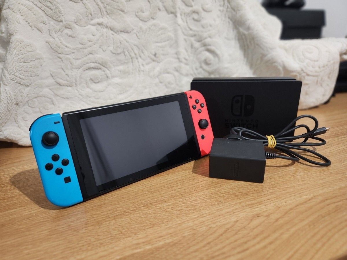 Nintendo Switch With All The Accessories Plus NBA 2k 26 And Super Mario Bros U Deluxe.