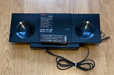 Sharp DK-KP85P Slim Micro System features a top-mounted dock for Apple Lightning devices The system also supports Bluetooth technology for wireless