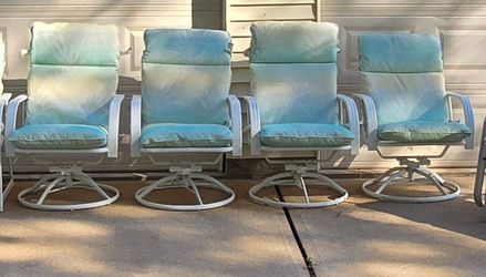 4 Aluminum outdoor swivel chairs w/ cushions
