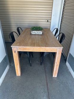 Heavy solid wood table and 4 metal chairs