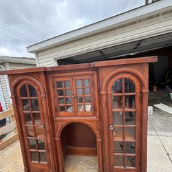 Antique storage cabinet with glass doors