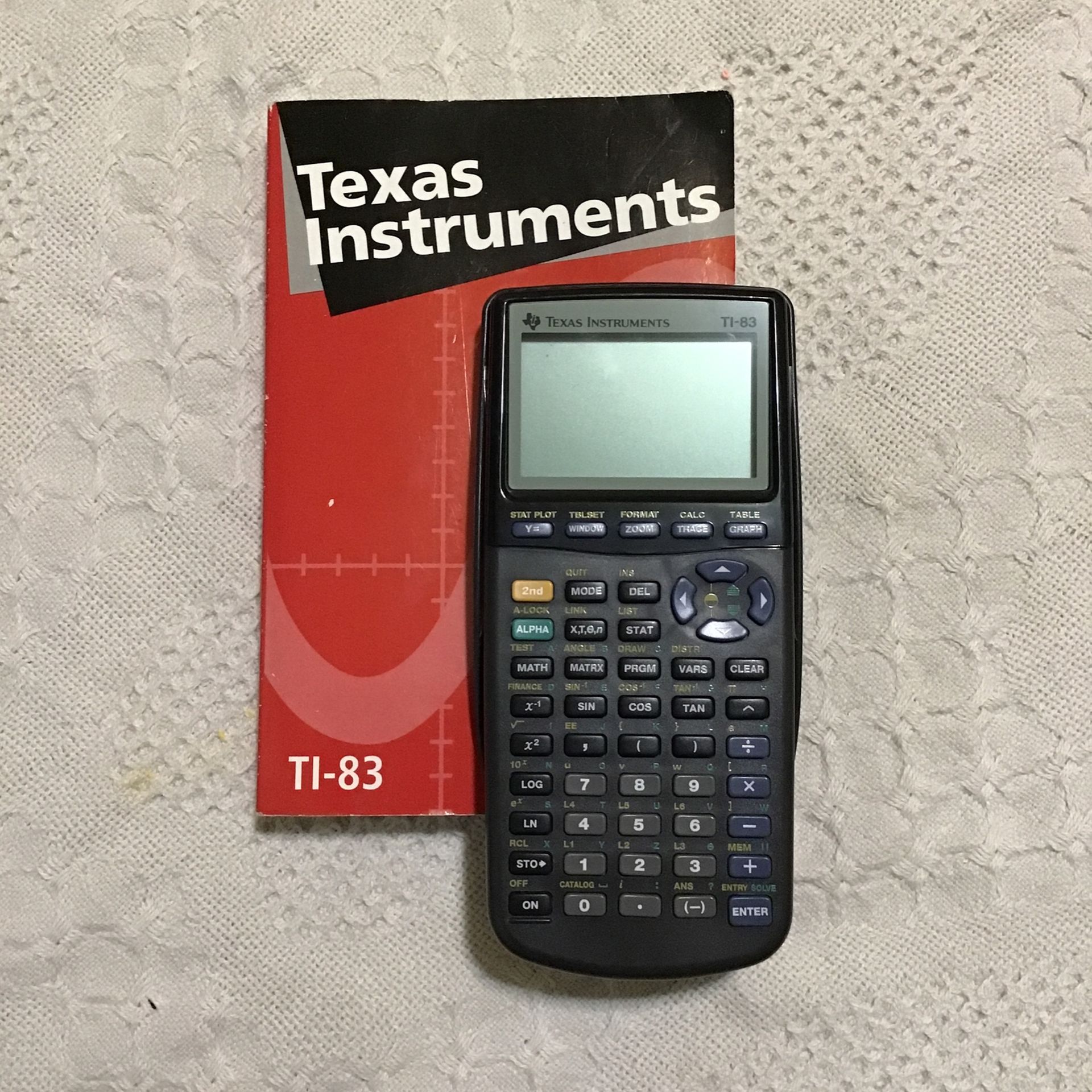 Texas Instrument TI-83 Graphing Calculator (with Book)