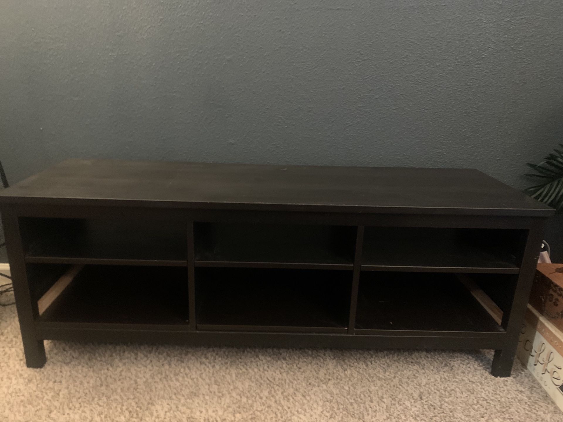 Black wood entertainment center with shelves