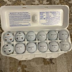 A Dozen TaylorMade Gold Balls
