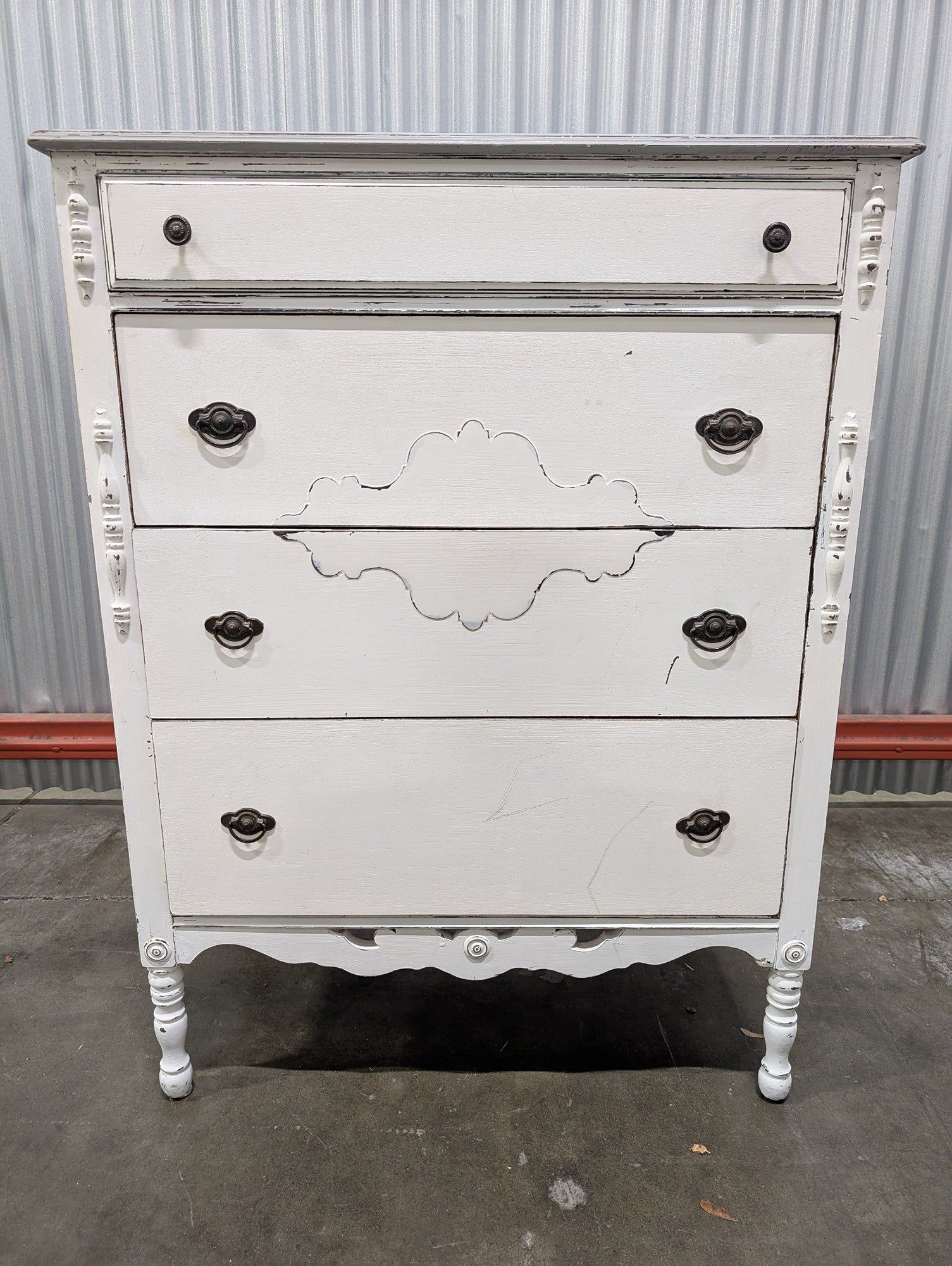 Distressed White Four-Drawer Chest with Carved Details
