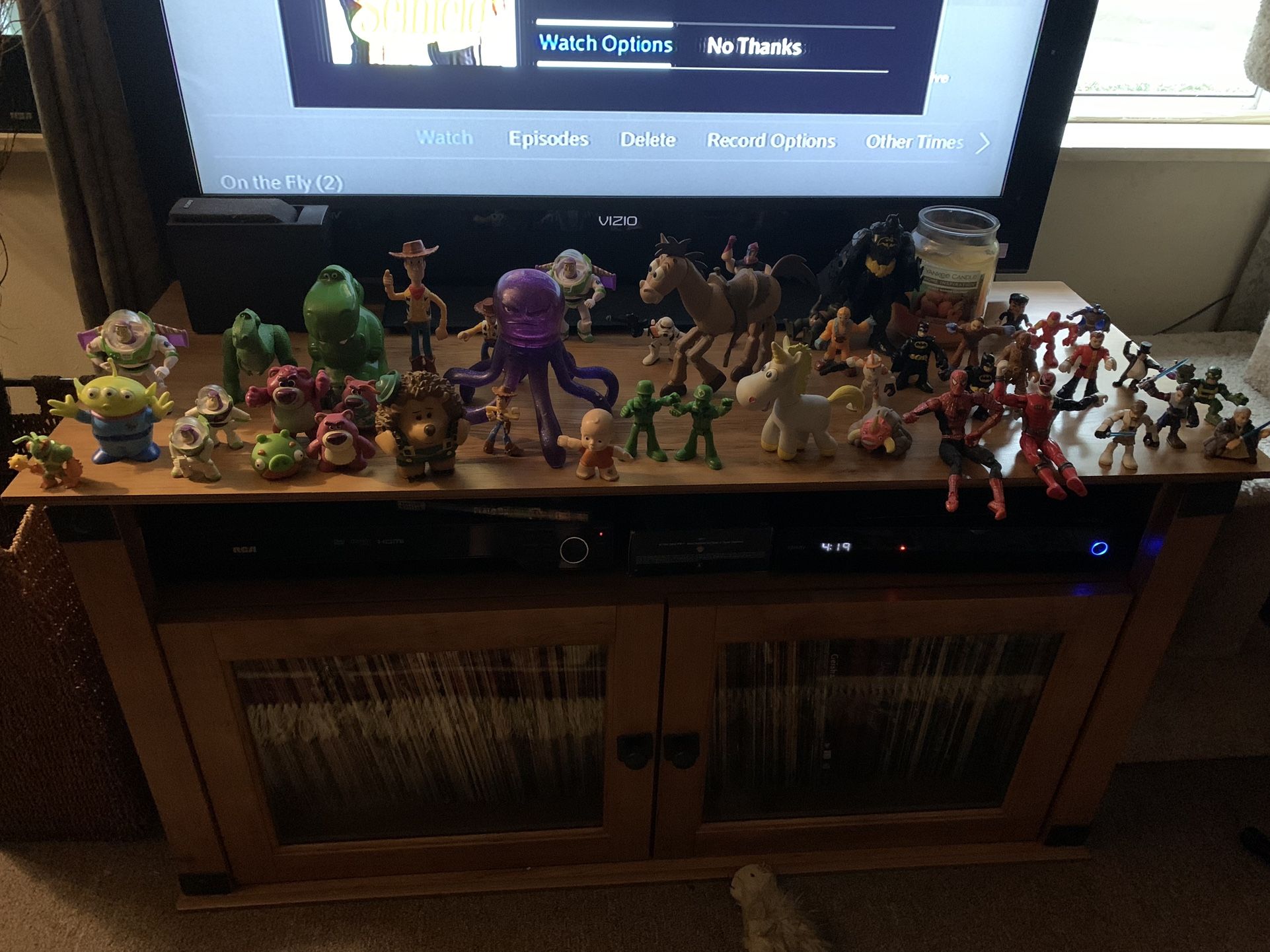 About 44 Action figures (toy story, star wars, batman etc)