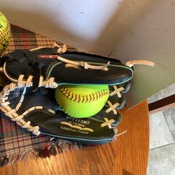 Rawlings 11.5” Girls softball glove, used once, comes with 2 softballs, leather palm, black and teal, Plainfield, Illinois
