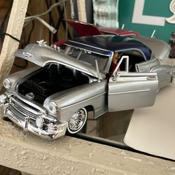 Silver Bomba Lowrider With Homie