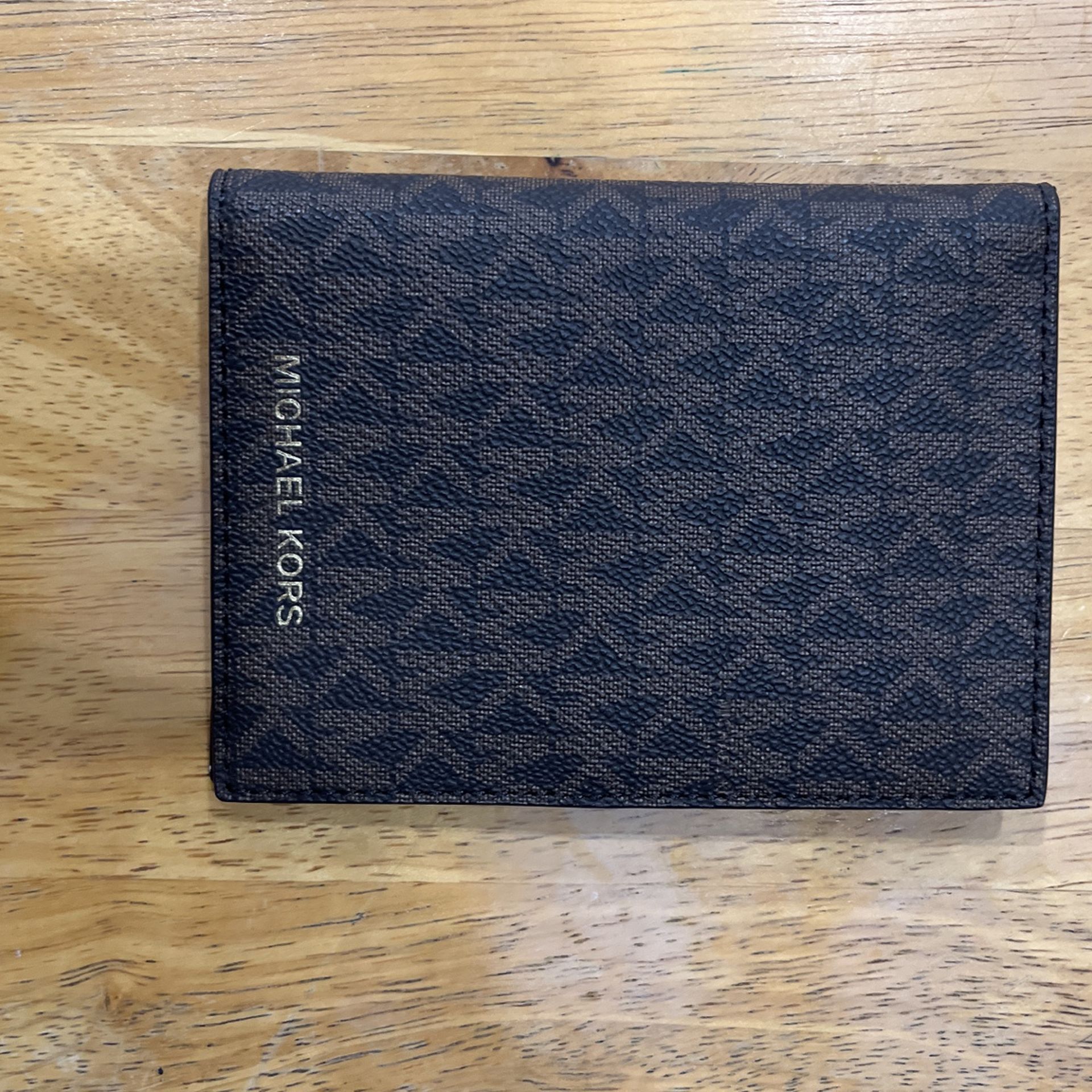 An Original Michael Kors Passport Holder