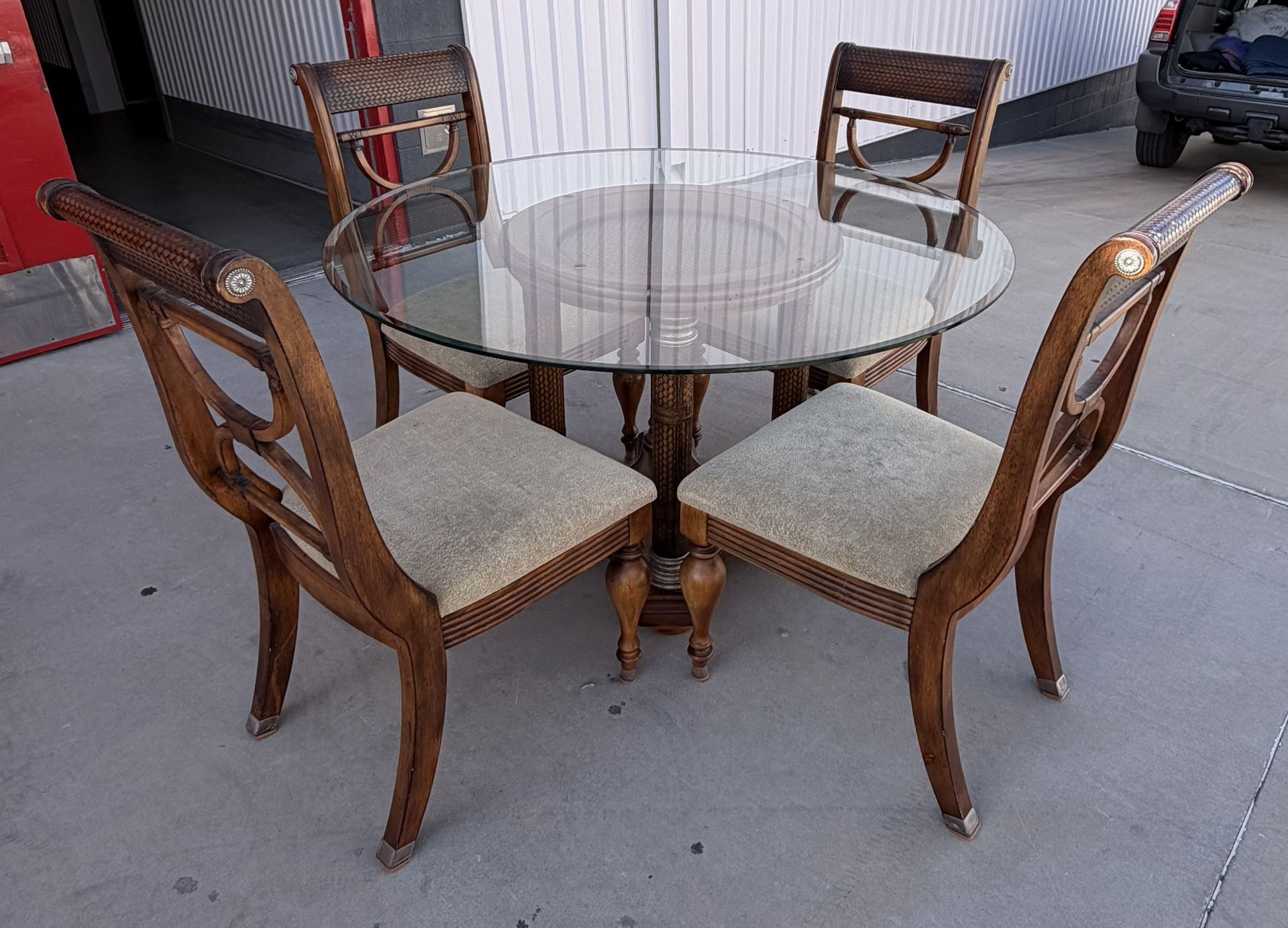 Serengeti Kuli Wood Round Pedestal 50" Dining Set with 4 chairs from Ashley Furniture