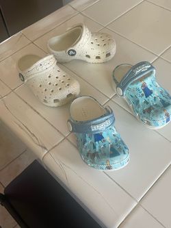 2 Pairs of Baby Girls Crocs in great condition size 5