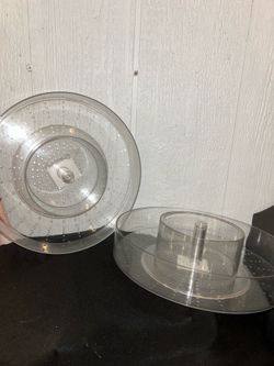 clear acrylic, rotating organizer designed for storing makeup or other personal items