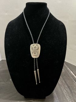 vintage bolo tie features a Native American-style bird design crafted by Florenta