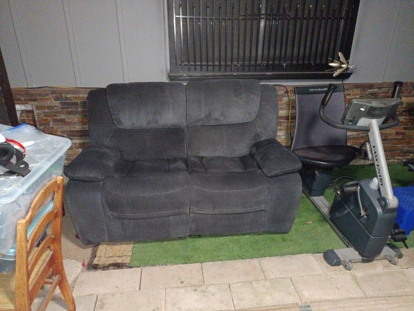Dual Backed Reclining Loveseat.