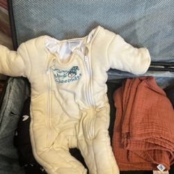 Merlin’s sleep Suit And changing mat 