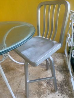 Metal Counter Height Stool -  with Modern Vertical Slat Back Stool with foot rest and swivels - retails for $130 . I have 3 stools