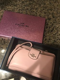 Pink Coach clutch.