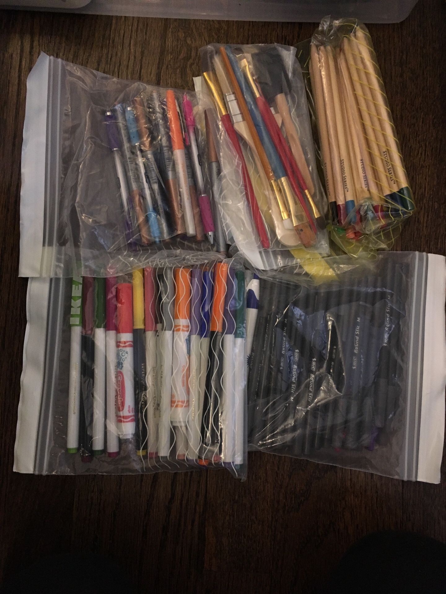 Art supplies. Paint brushes, colored pencils, pens, markers