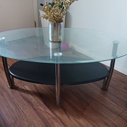 Glass coffee table for the living room. It is used $40.
