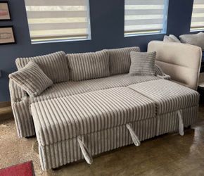 New storage sectional with pull out and free delivery