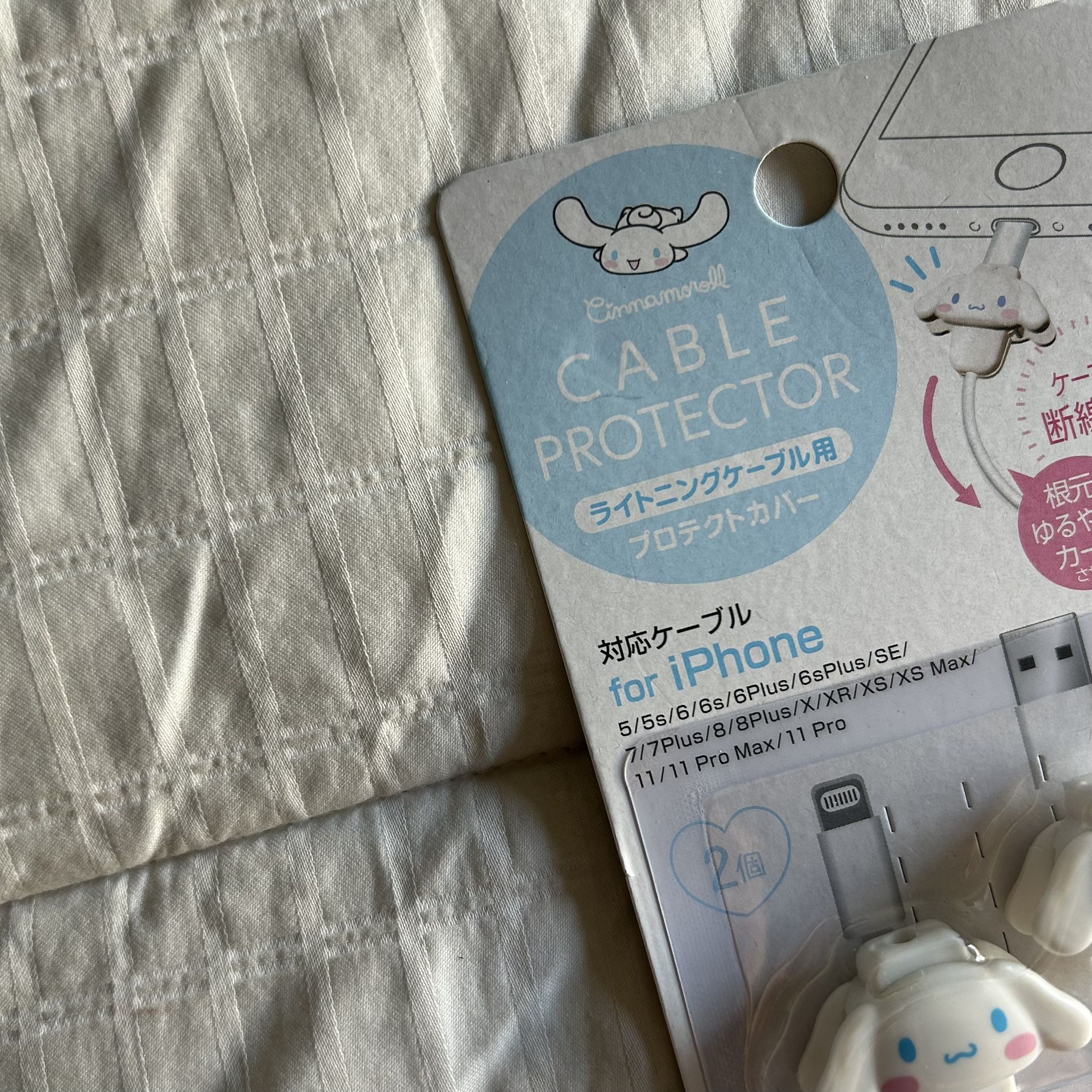 sanrio cinnamoroll cable protectors — white, blue, & pink.