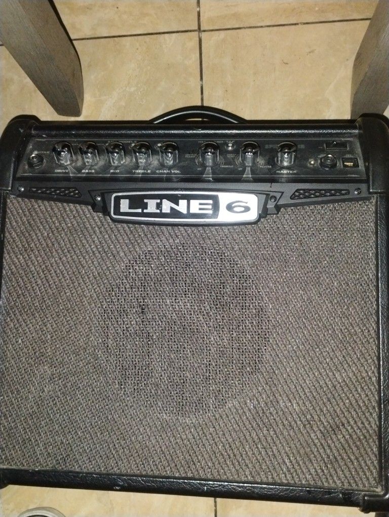 Line 6 Speaker And A Kona Electric Guitar