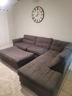 Grey sectional Couch and Ottoman