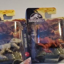 2 Minature Jurassic World Figurines. Approx  2 1/2"