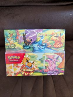 Pokemon Prismatic Evolution Tin Display