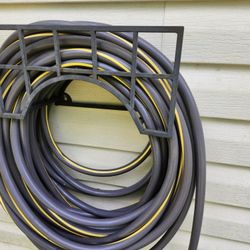 GARDEN HOSE  100 FT. WITH A REEL.