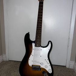 Squier Stratocaster Electric Guitar + Frontman 10G Amp