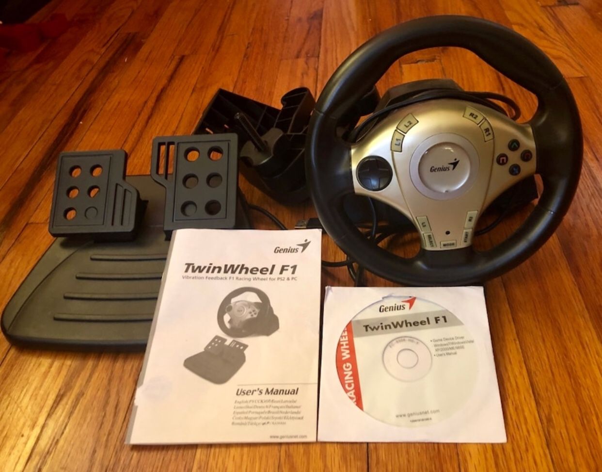 Genius Twin wheel F1 (Vibration feedback F1 Racing Wheel for PS2 and PC $30