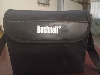 Bushnell binoculars with carry strap and carrying case