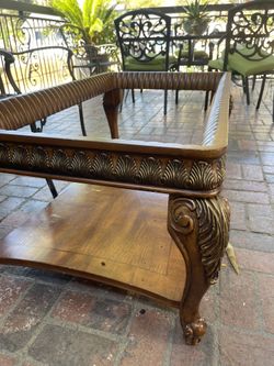 Vintage wood coffee table with glass top