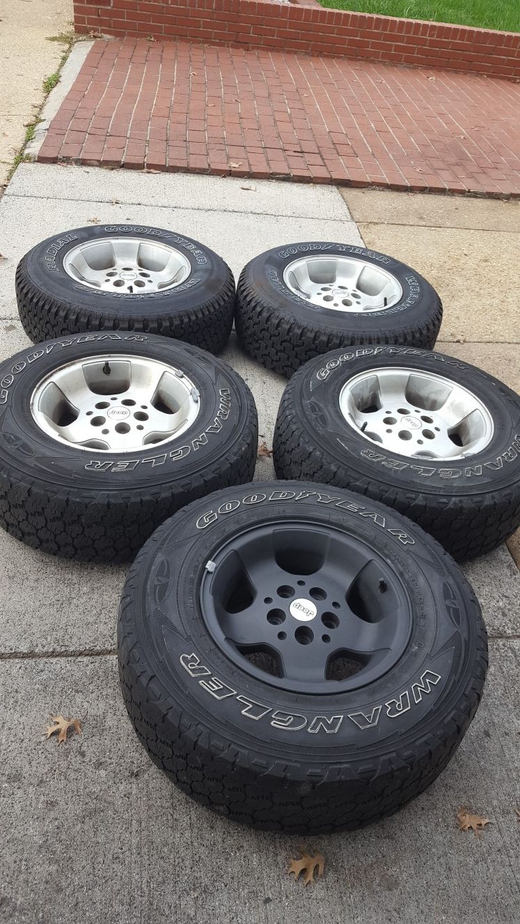 5 original jeep wrangler rims and tires-Goodyear Wrangler P235 75R 15.