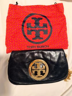 •	Tory Burch gold medallion Shoulder Bag