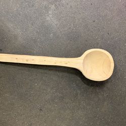 Wood spoon. Roughly measures 12 inches in length