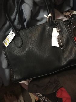 Arm held black purse