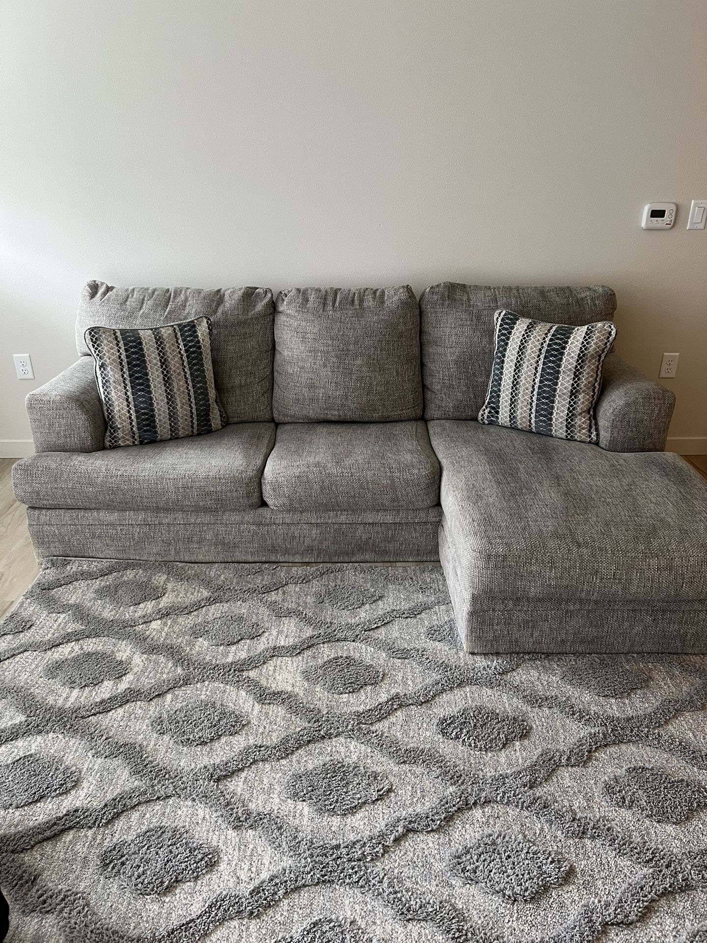 Ashley Sofa Chaiser Couch And Area Rugs