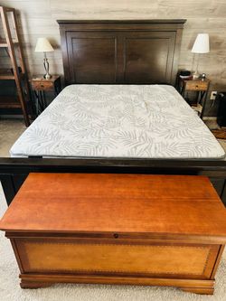 Queen Sealy Carver Firm Mattress with Dark Wood Frame