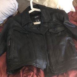 Genuine black leather motorcycle jacket with insulated lining. size Medium, fits slim