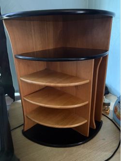 wood-and-black desk corner organizer features a curved multi-tier shelf design
