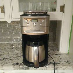 Cuisinart coffee maker and grinder in one. Has a dent in carafe.
