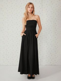 Long black tubular dress with pockets