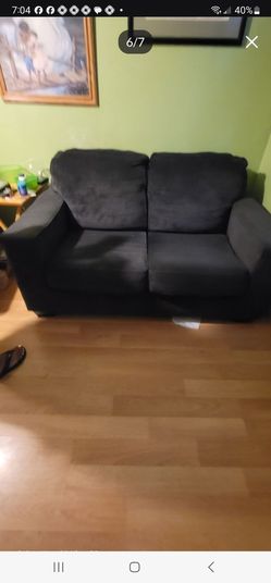 Black Fabric Loveseat Sofa and chair in excellent condition firm price dont miss out. No Rips or stains